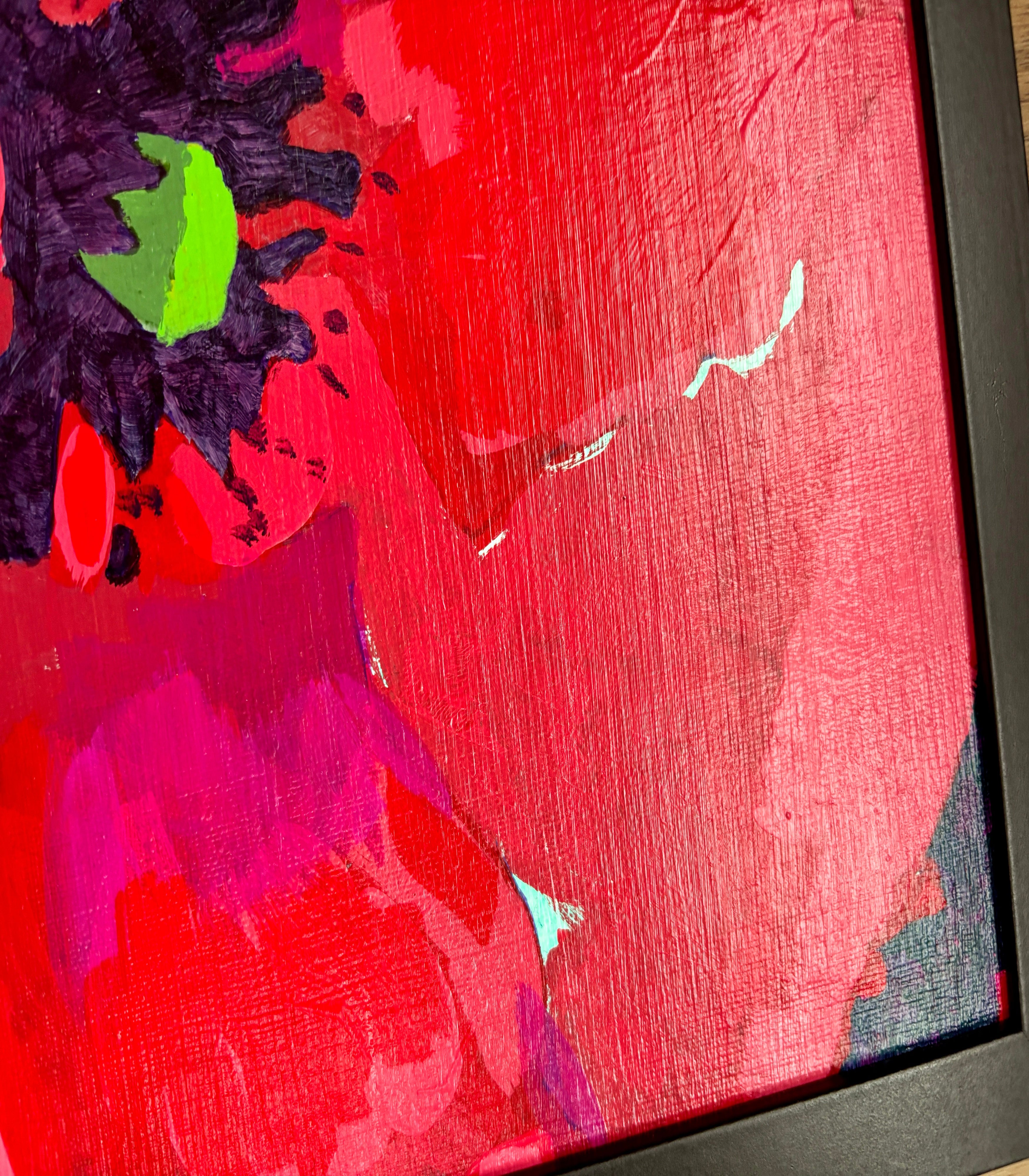 Abstract painting with red, purple, and green colors on a textured surface.