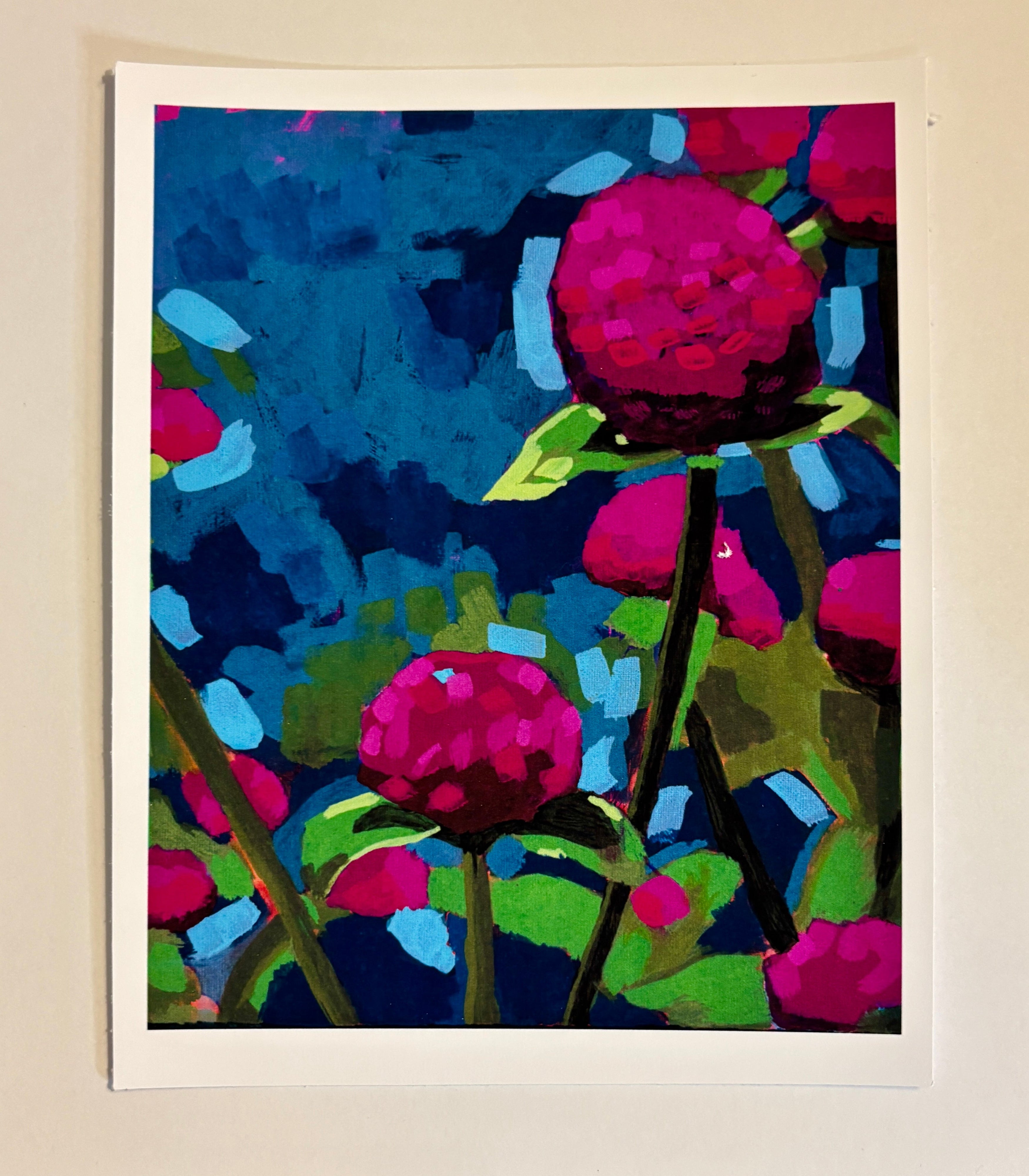 Colorful floral artwork on a beige wall